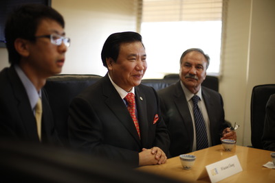 Chinese inventor and businessman Winston Chung with Reza Abbaschian, dean of the Bourns College of Engineering, looking on.