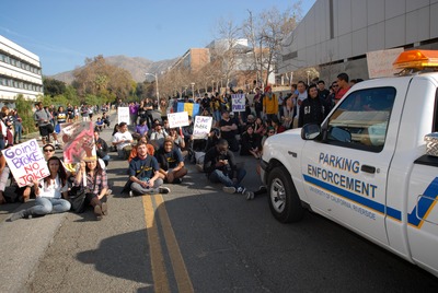 Protesters blocked exits to try to prevent the Regents from leaving. Photo by Carrie Rosema.